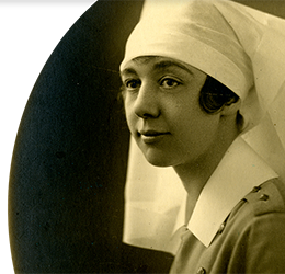 Sepia photograph of Helen Kendall's passport photo. Helen is wearing her uniform and looking directly at the camera.