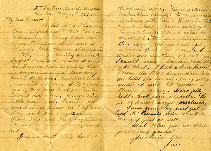 Sepia composite image of two pieces of paper side by side; it is a letter in two pages and there are deep crease lines on each page from folding.